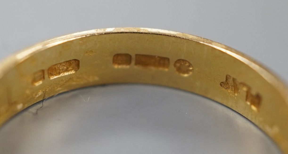 A modern 18ct two colour gold band, size L